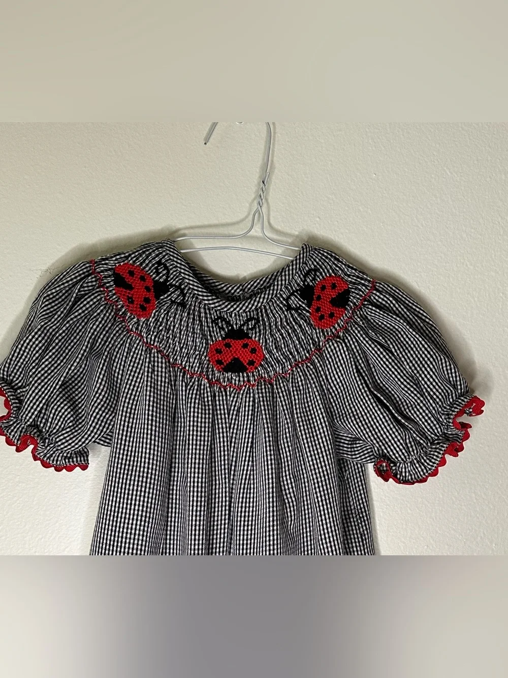 Smockadot Kids 9 month size with ladybug smocking with snap crotch .